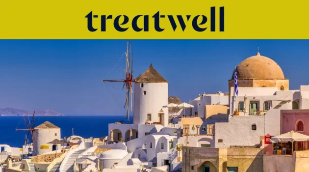 White-washed houses and traditional windmills above the deep blue Aegean in Oia, Santorini, beneath a yellow banner carrying the Treatwell logo.