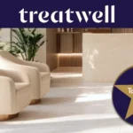 Treatwell Top Rated 2026 badge, earned through client reviews, over a bright salon reception with cream armchairs and plants